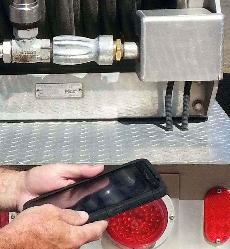 The rear deck of a propane bobtail: the delivery hose reel, coupling and valve manifold.